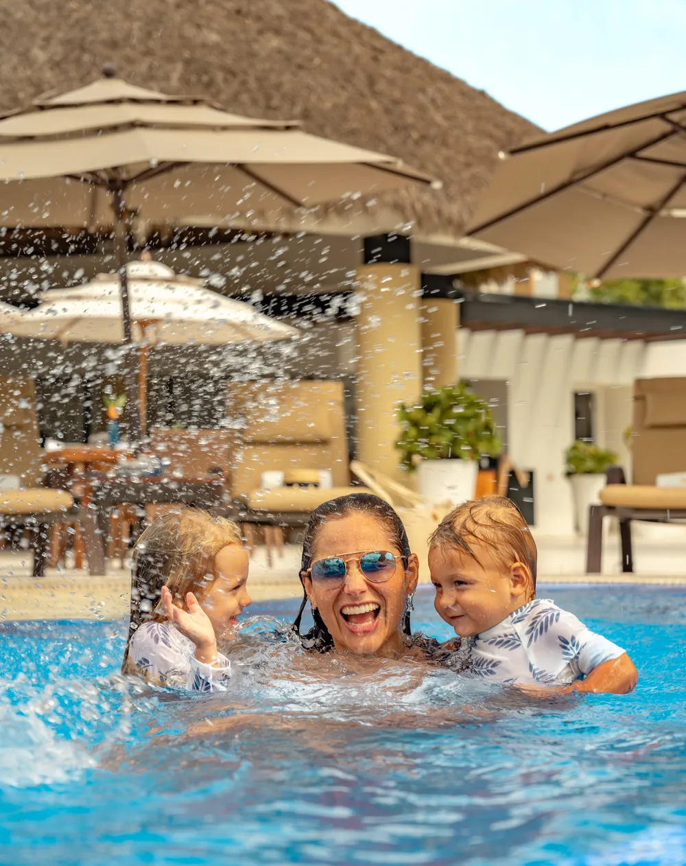 Vista aérea del resort Marival Armony Luxury Resort & Suites en Punta de Mita, mostrando la piscina infinita y el océano Pacífico al fondo.